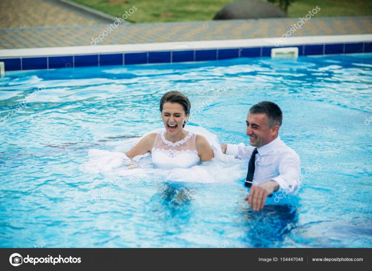 Young Couple Jumping In The Swimming Pool In A Wedding concernant French Swimming Licences